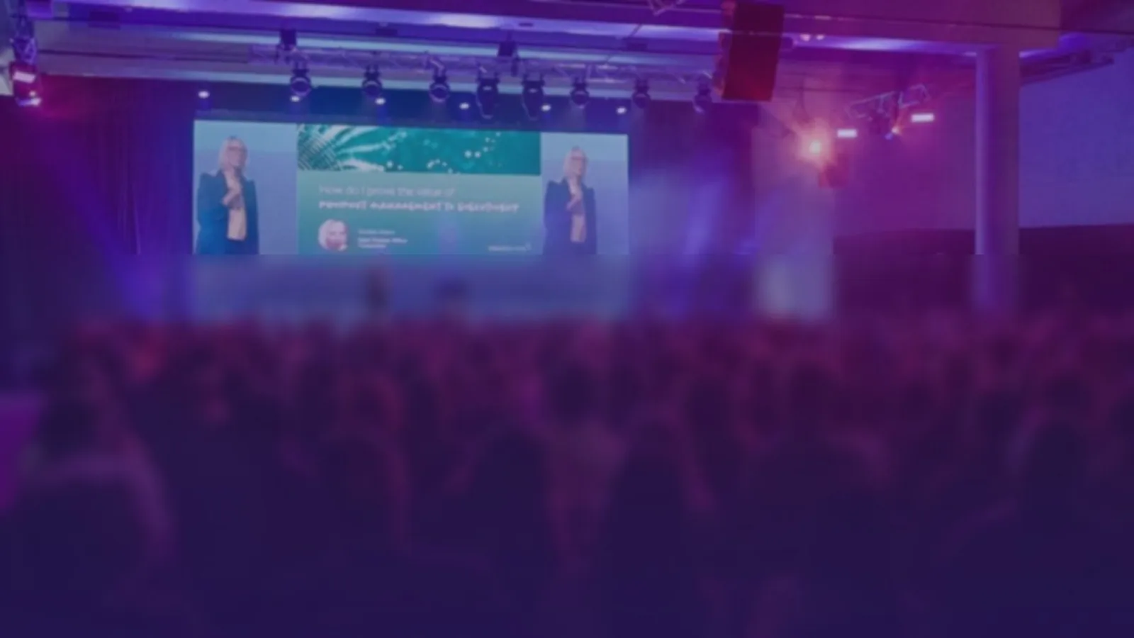 Kirsten on stage delivering a keynote